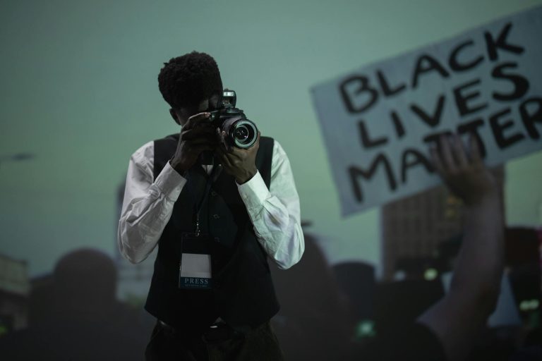 A photojournalist capturing a pivotal moment at a Black Lives Matter protest.